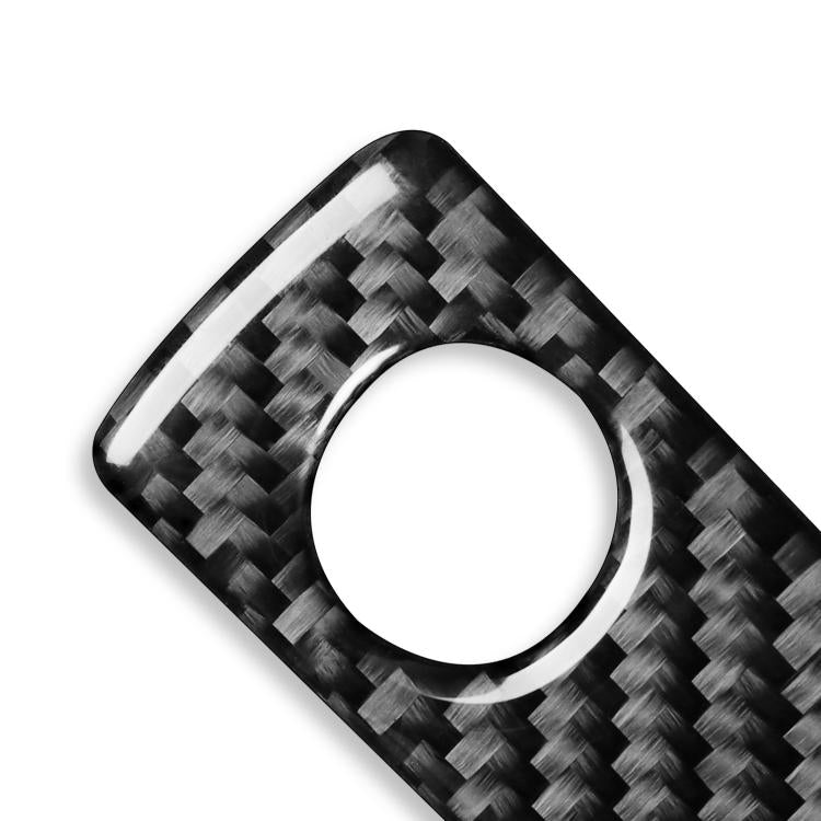 Glove box handle sticker, carbon-fiber style with circular opening, angled view