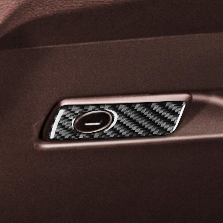Close-up glove box handle trim sticker, carbon-fiber pattern with circular center