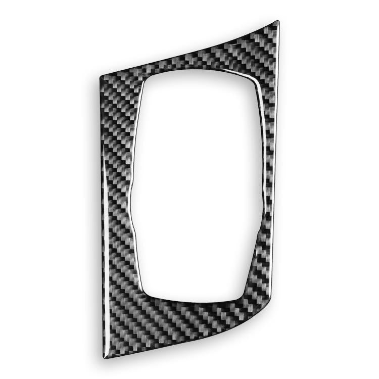 Carbon-fiber multimedia knob panel sticker with oval cutout, left-hand drive.