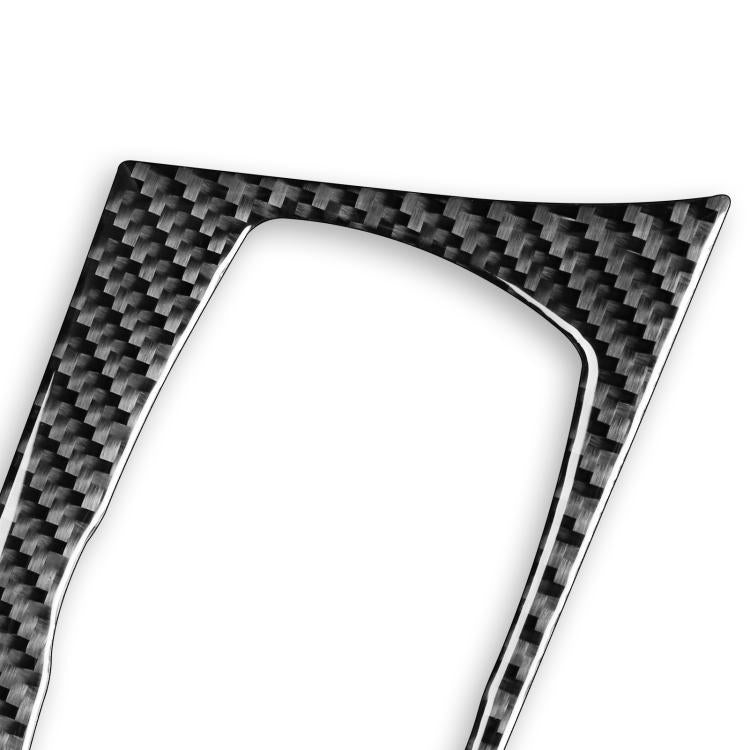 Carbon-fiber trim sticker with curved opening for multimedia control knob.