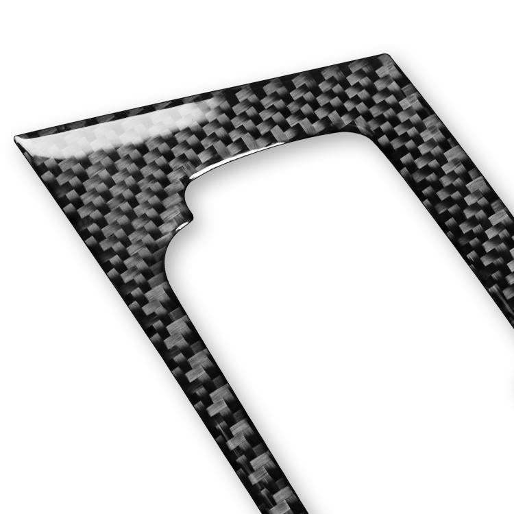 Black carbon-fiber textured trim sticker with curved cutout, corner close-up