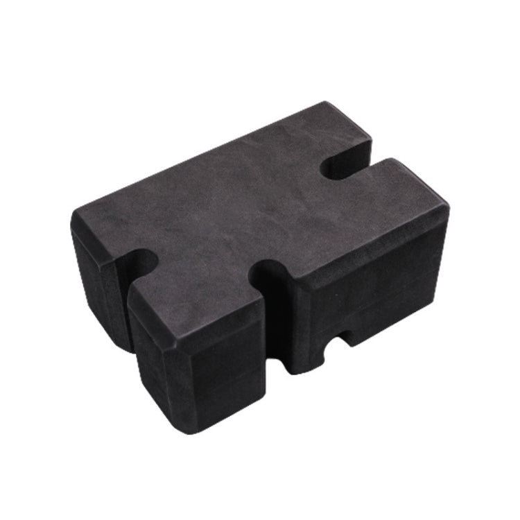 Dark foam bench press brick with molded cutouts for grip and alignment