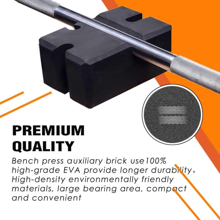 Black foam bench press auxiliary brick under a barbell with textured surface