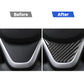 Installed steering wheel chin trim, black carbon-fiber insert on steering column surround