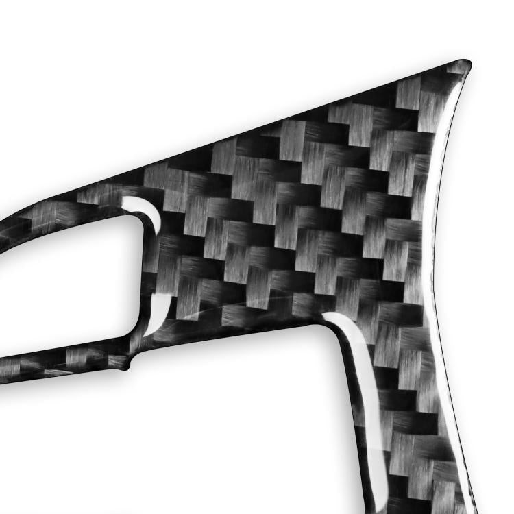 Close-up steering wheel button sticker showing carbon-fiber weave texture
