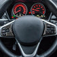 Steering wheel with carbon-fiber button sticker accents around controls