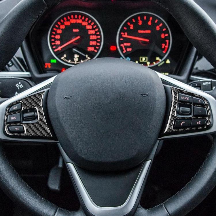 Steering wheel with carbon-fiber button sticker accents around controls