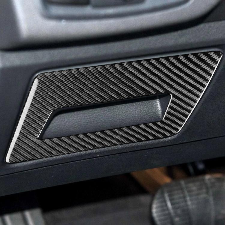 Installed carbon fiber-look sticker on seat panel storage handle with rectangular cutout