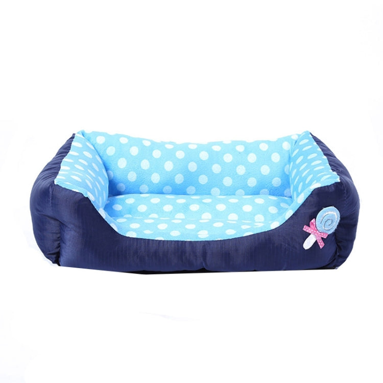 Square pet bed cushion with blue polka-dot lining and dark side bolsters