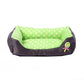 Square pet kennel cushion with green polka dot interior and dark trim
