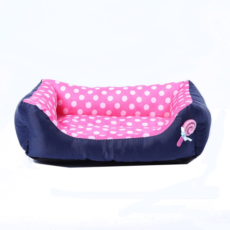 Square pet kennel cushion with pink polka dot center and dark side bolsters