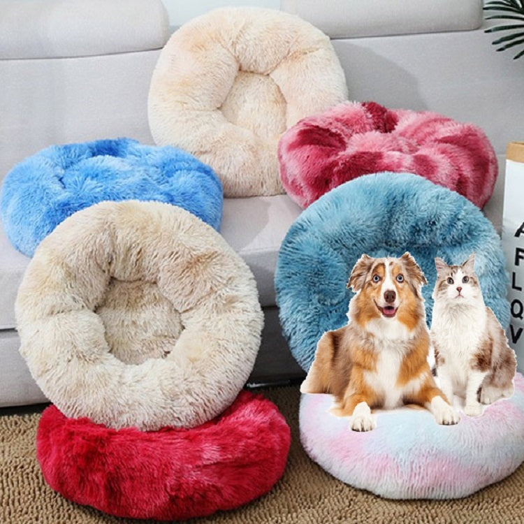 Round plush pet bed set in pink, blue, red, and cream with cushioned center