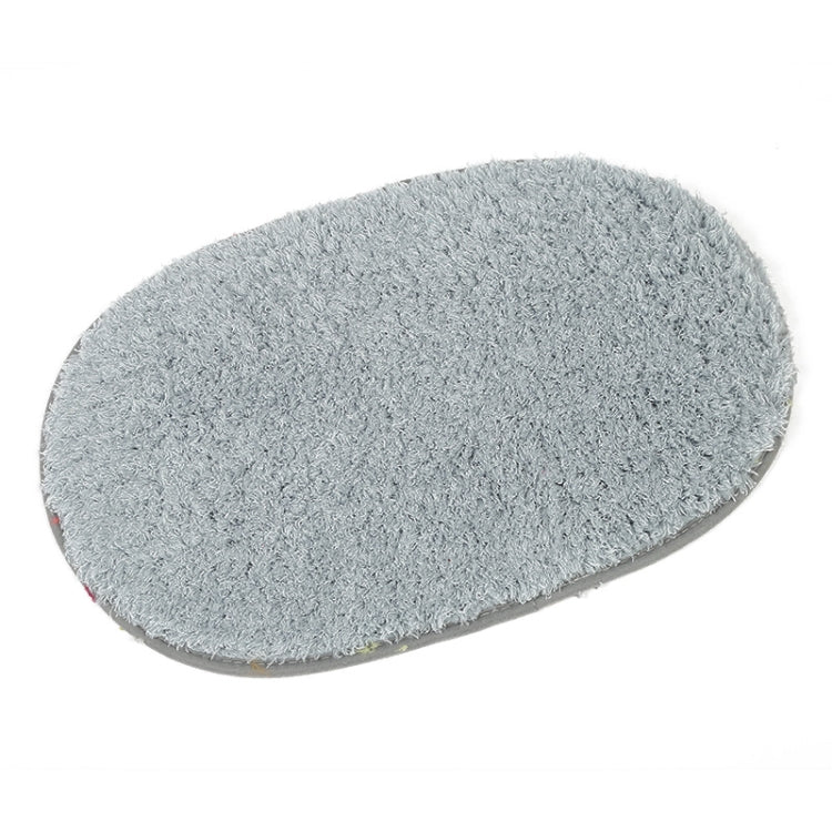 Grey oval plush pet bed pad with soft shag texture