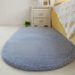 Light blue oval plush pet bed pad with short shag pile