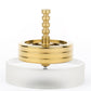 Brass-colored polished fidget spinner with stacked ring base and central post