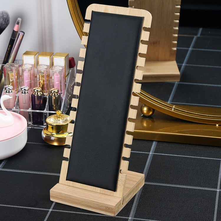 Bamboo necklace stand with dark velvet panel, notched back, and wooden base