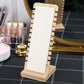 Bamboo necklace stand with white velvet panel, notched back, and wooden base