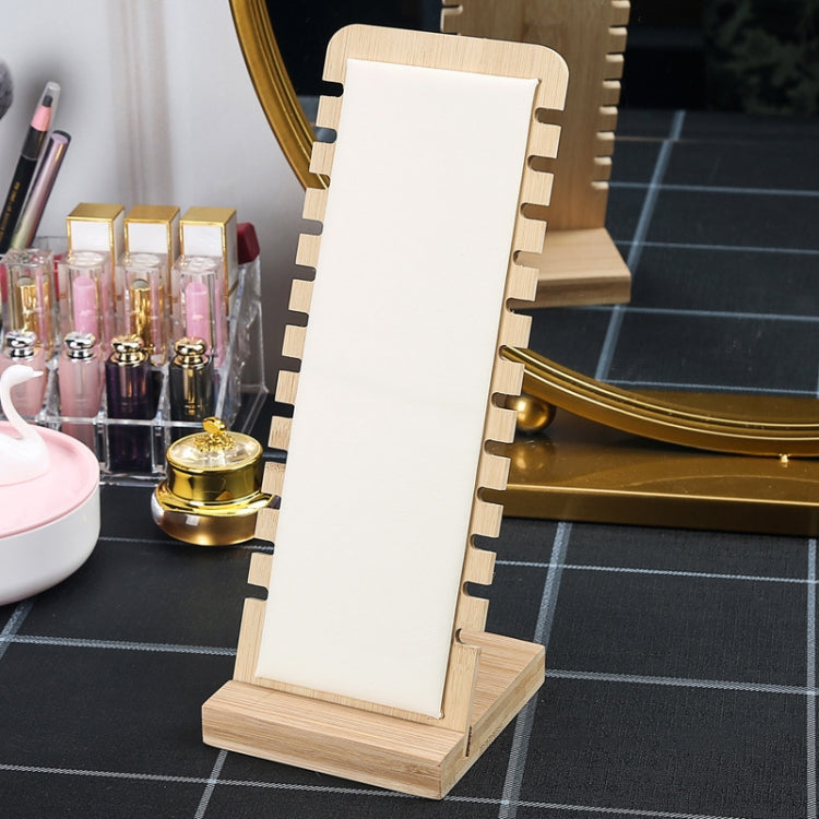 Bamboo necklace stand with white velvet panel, notched back, and wooden base