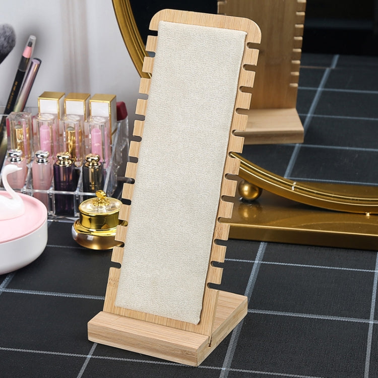 Bamboo necklace stand with beige fabric panel, notched back, and wooden base