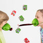 Green frog tongue-out game toy held by children with scattered number cards