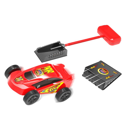 Red rocket-style race car with pedal launcher and black jump ramp pad