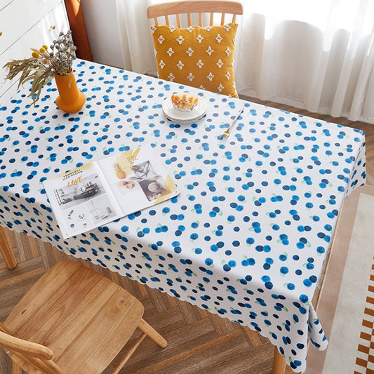 PVC waterproof table cloth with small blue dot pattern on a white base