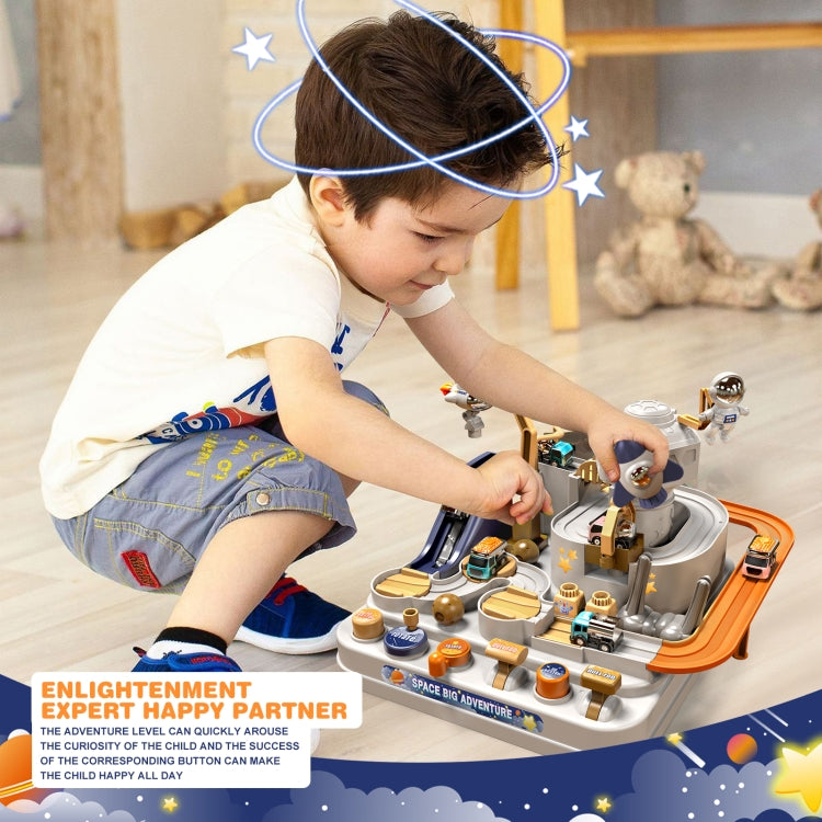 Space-themed mechanical rail car track toy being played with by a child