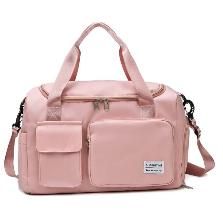Soft pink waterproof travel gym bag with front zip pocket, dual handles, and shoulder strap