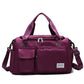 Deep purple waterproof travel gym bag with front zip pockets and shoulder strap