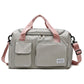 Light gray waterproof travel duffel bag with front pockets and pink adjustable shoulder strap