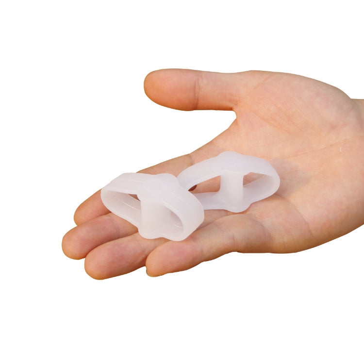 White double ring toe separator on hand, curved spacer for toes