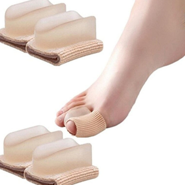 Beige tube toe separator worn on big toe, ribbed sleeve supports toe alignment