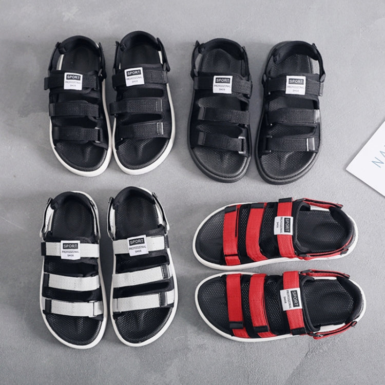 Pair of black sandals with adjustable straps and open toe, plus red-striped pair