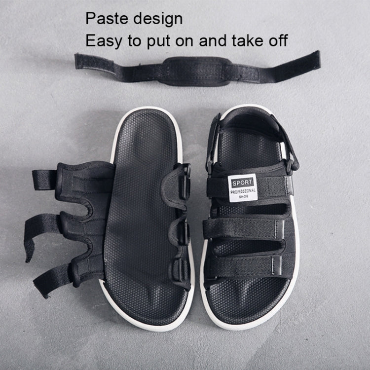 Black athletic sandals with textured footbed, two hook-and-loop straps, white outsole