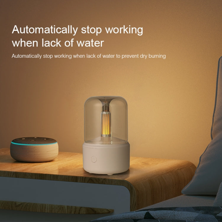 Beige aroma diffuser with simulated candlelight glass top on a nightstand