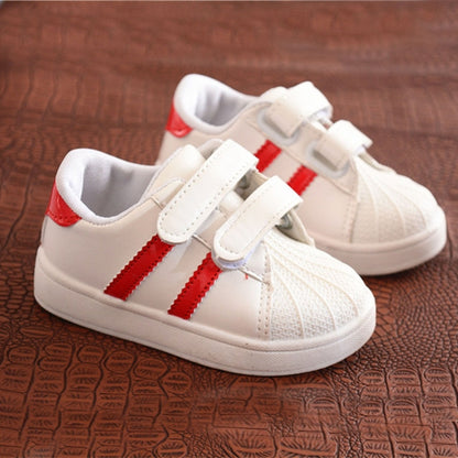 Children's white sneakers with red side stripes and double hook-and-loop straps