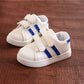 Children's white sneakers with blue side stripes and double hook-and-loop straps