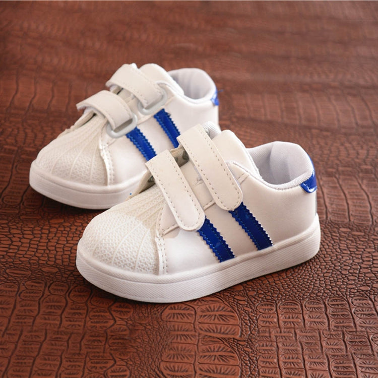 Children's white sneakers with blue side stripes and double hook-and-loop straps