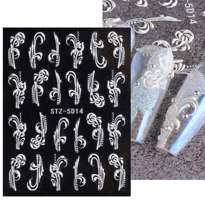 3D carved nail art sticker sheet with white baroque scroll patterns on black base