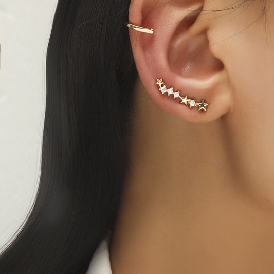 Gold-tone star and zircon ear climber earrings, small hoop cuff and star row