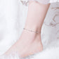 S925 silver ball-charm anklet worn on ankle with thin chain and clasp
