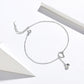 Silver cat bell anklet with heart-teardrop charm and small bell dangle