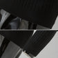 Black sweater sleeve and ribbed cuff close-up, knit texture detail