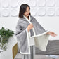 Light grey flannel shawl blanket with white fleece-lined edge, draped over shoulders