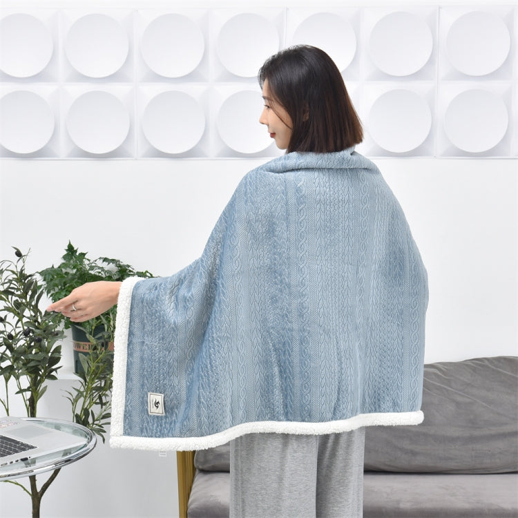 Misty blue flannel shawl blanket back view with embossed pattern and white fleece trim