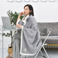 Light grey flannel shawl blanket with white fleece trim, draped for indoor use