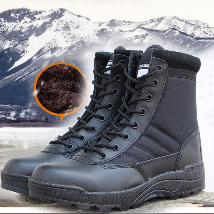 Pair of black padded high-top sports boots with lace-up fronts and thick rubber soles