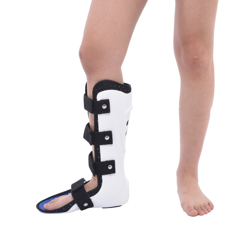 Worn ankle foot support brace with black straps and white boot shell