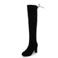 Black over-the-knee boots with thick heel and side tie detail