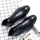 Men's pointed black leather lace-up dress boots with ankle height and pull tab